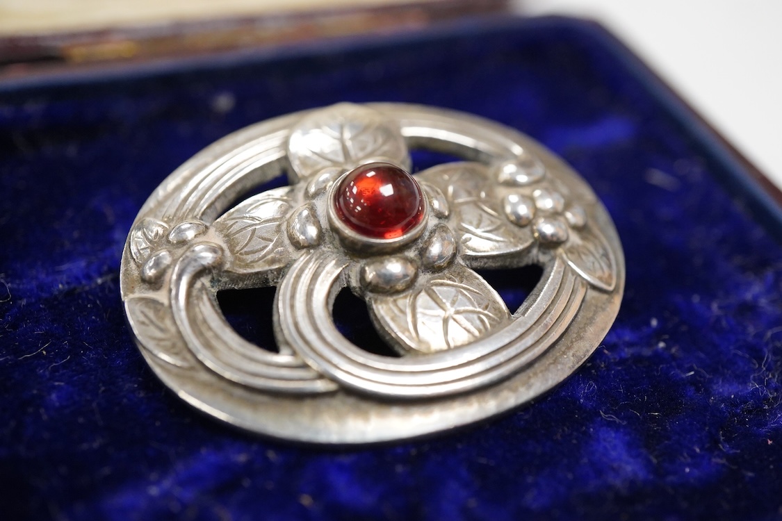 A Georg Jensen 925S and single stone cabochon garnet set oval brooch, design no. 138, 38mm.